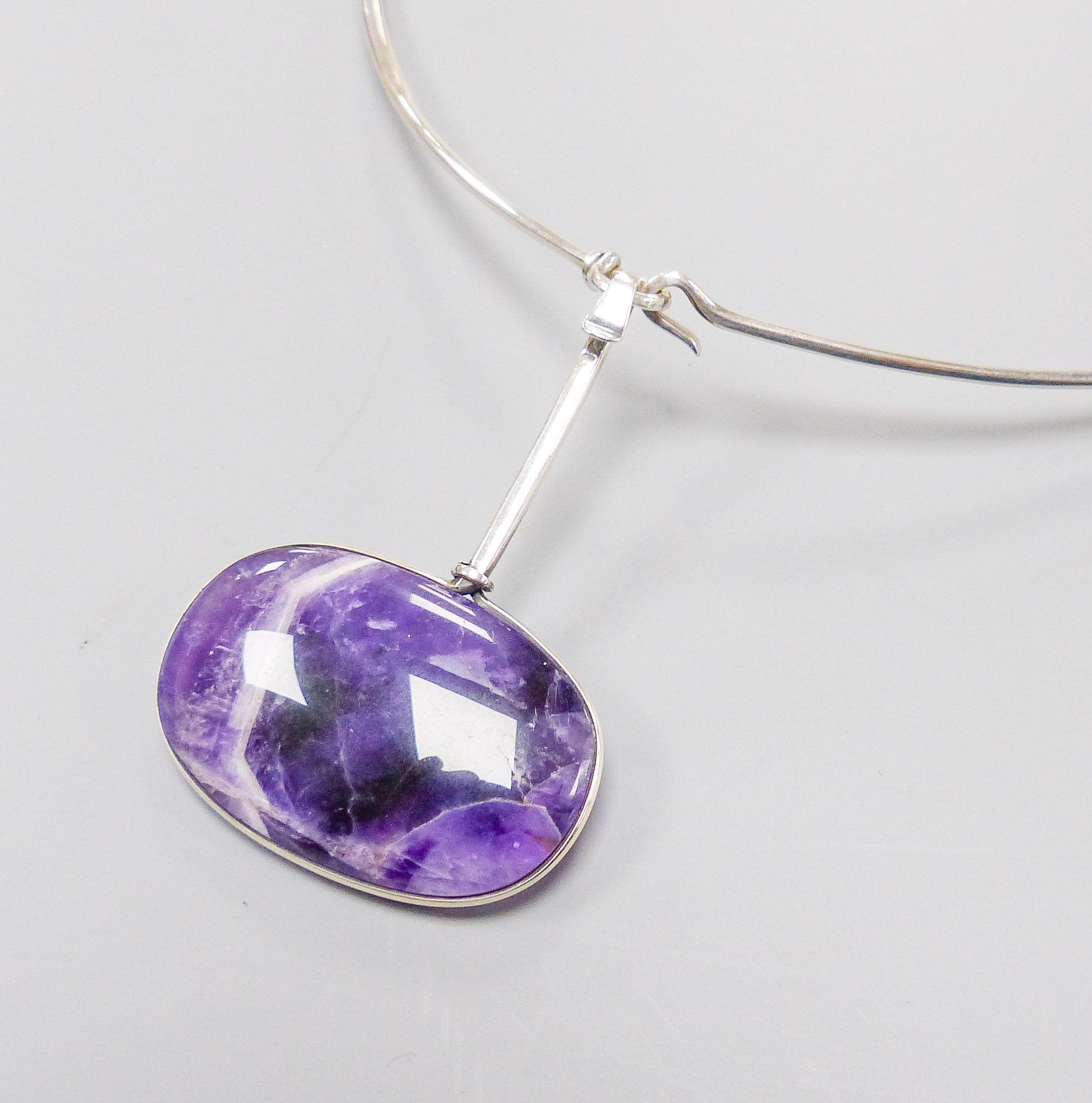 A Torun for Georg Jensen sterling and amethyst quartz set pendant, no. 133, 64mm, on a Torun for Georg Jensen sterling necklet, no. 174.